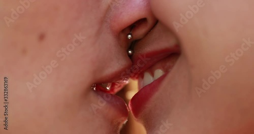 Lesbian french kiss close-up. Tongue in lesbian girl mouth. Two women oral sex. sex between girlfriends