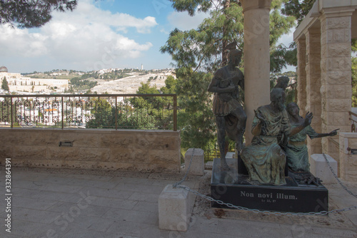 Sculptural group with the apostle Peter in the center in courtyard of the Church of St. Peter in Gallicantu in Jerusalem, Israel. photo