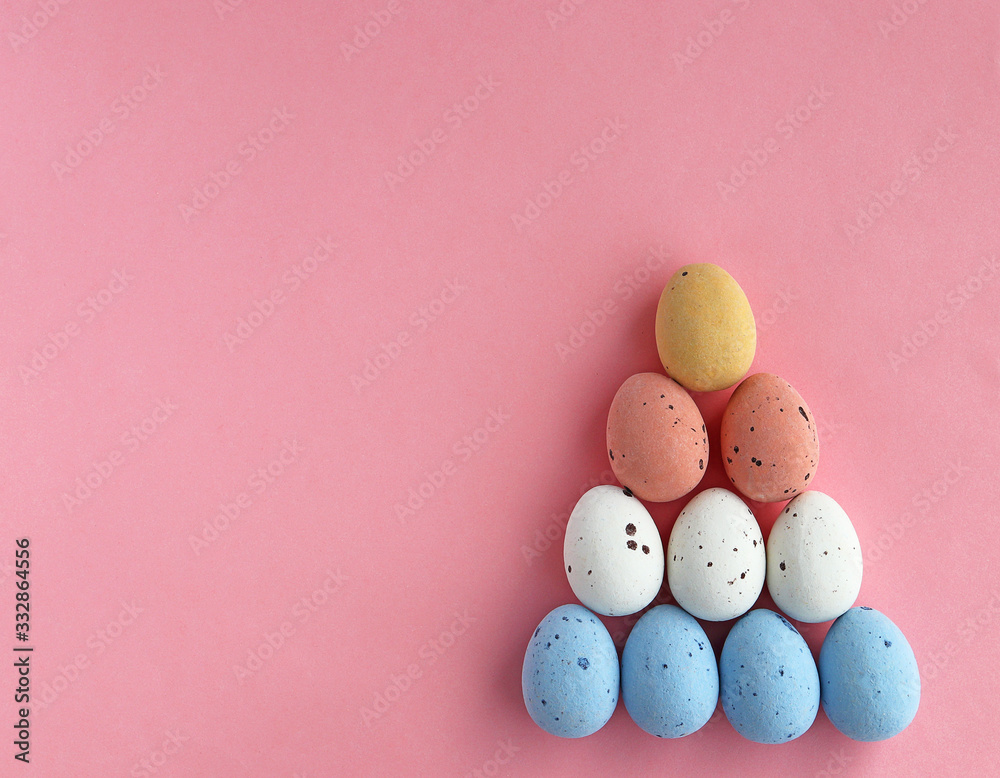 Easter colored eggs on a pink background