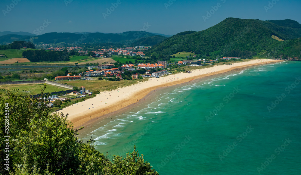 Top view of large beach and small towns in the countryside