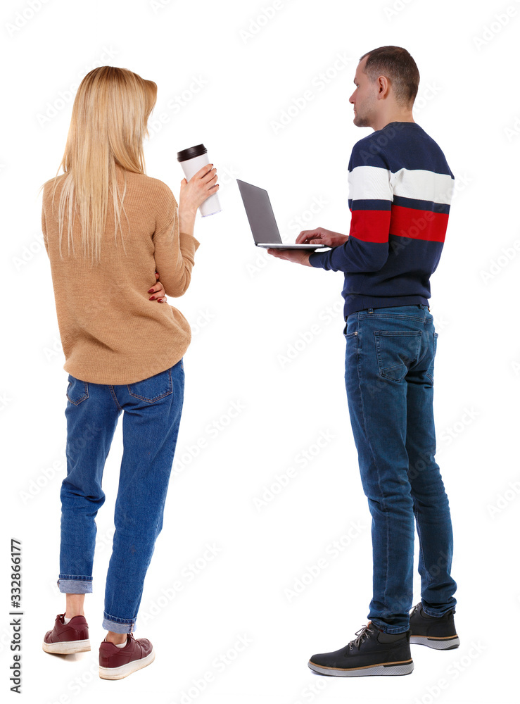 Back view couple with laptop in sweater. Back view couple with laptop in sweater.