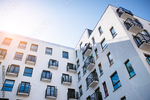 Wallpaper Mural Modern apartment building flat estate concept. Outdoor residential facility at sunset and sunrise. Torontodigital.ca