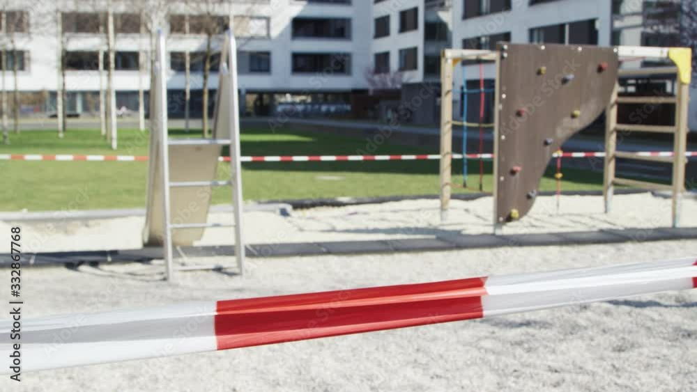 Children playground barricaded with tape, quarantine, Covid-19 concept Children playground barricaded with tape, quarantine, Covid-19 concept