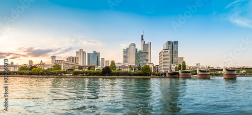 Fotografie Panoramic view of Frankfurt am Main skyline with touristic boat, promenade and s