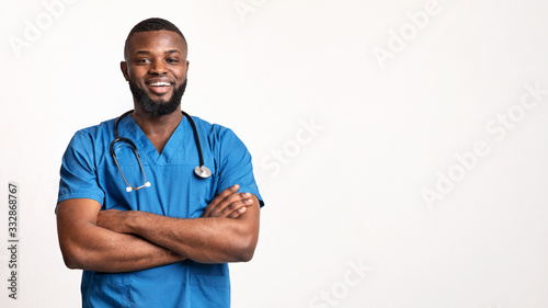 Young african surgeon posing over white background photo