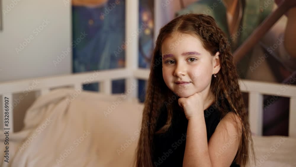 People: portrait of a beautiful young girl in a black t-shirt at home People: portrait of a beautiful young girl in a black t-shirt at home