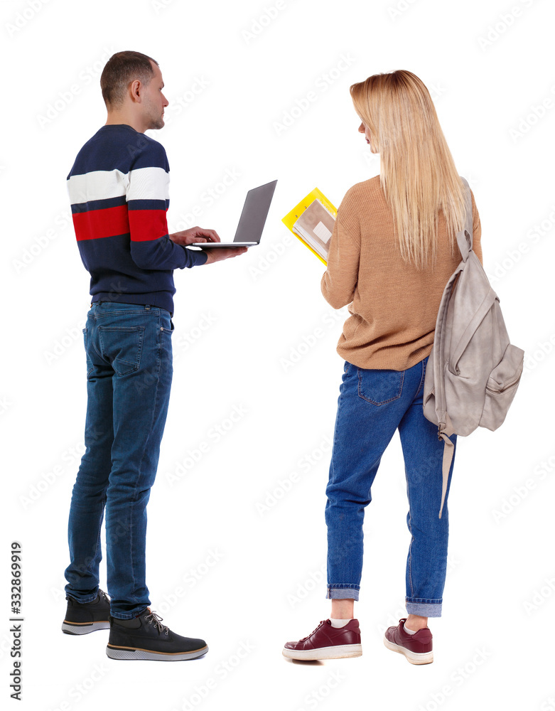 Back view couple with laptop in sweater. Back view couple with laptop in sweater.