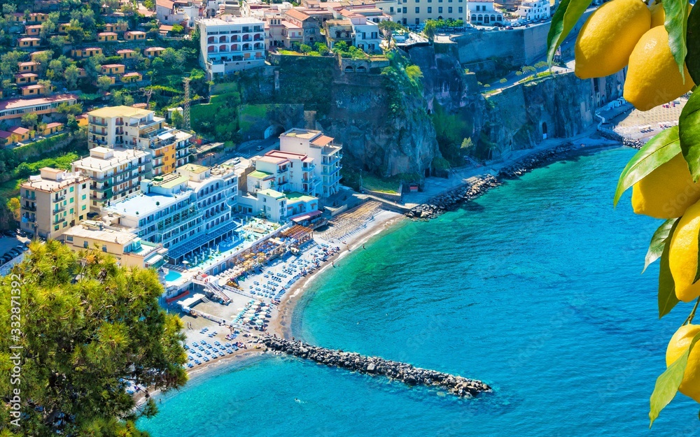 Aerial view of cliff coastline Sorrento and Gulf of Naples, Italy. Clear azure sea and luxury hotels of Sorrento attract lot of tourists from all over world.