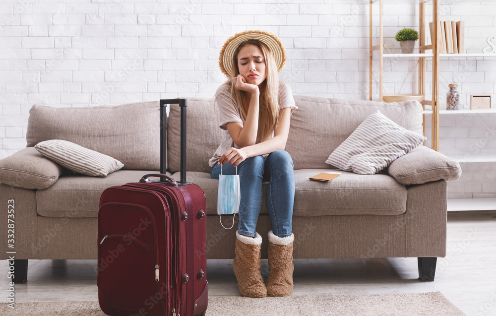 Travel cancel and sad woman stay at home Travel cancel and sad woman stay at home
