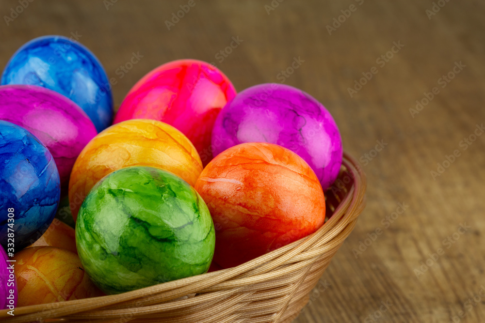 colorful easter eggs in an easter basket closeup colorful easter eggs in an easter basket closeup