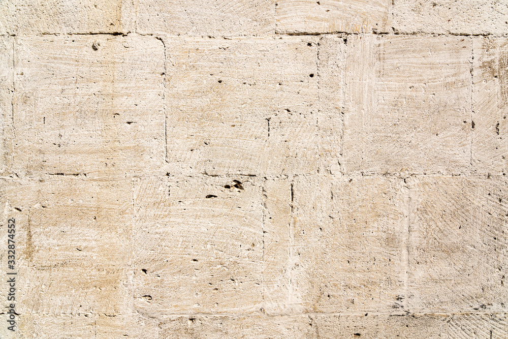Obraz premium Weathered limestone wall background texture