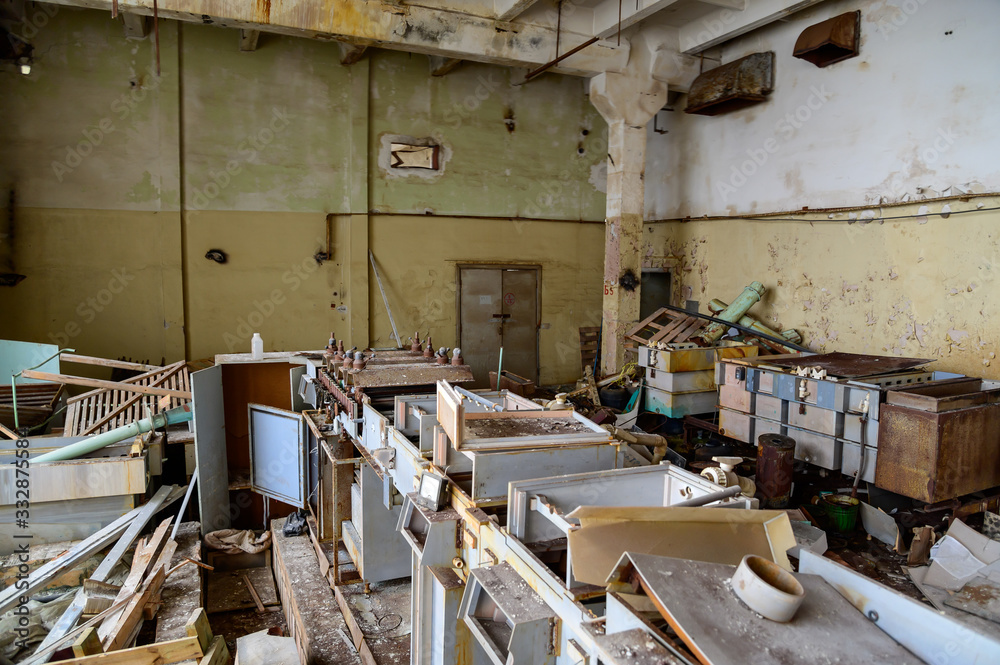 Photo of garbage indoors on the ruins of a slum plant Photo of garbage indoors on the ruins of a slum plant