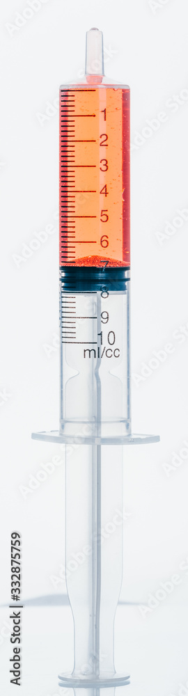 Medical Syringe with needle isolated on white, macro shooting. Isolated syringe filled with red medication liquid. Fluid is like blood with bubbles. Medical Syringe with needle isolated on white, macro shooting. Isolated syringe filled with red medication liquid. Fluid is like blood with bubbles.