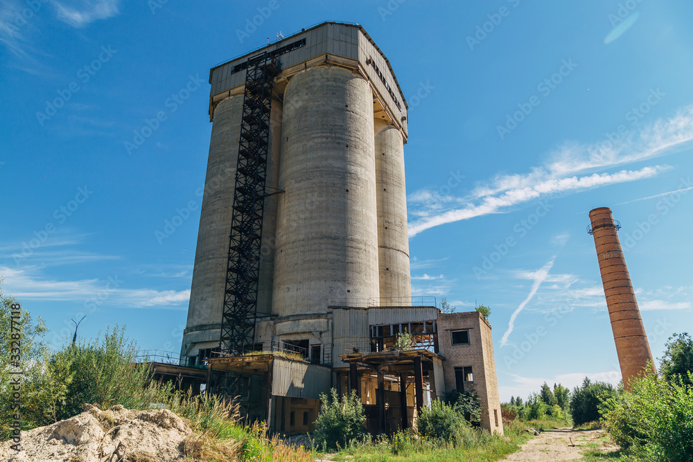 Old overgrown abandoned factory of reinforced concrete