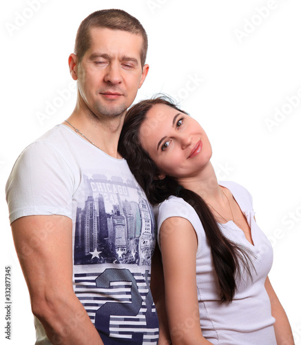 Couple, man and woman stand by and look into camera