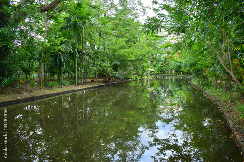 landscape of public park in the morning with view of water small pond