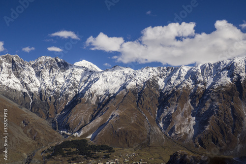 High mountains in Kazbegi district - peaks with snow on it.