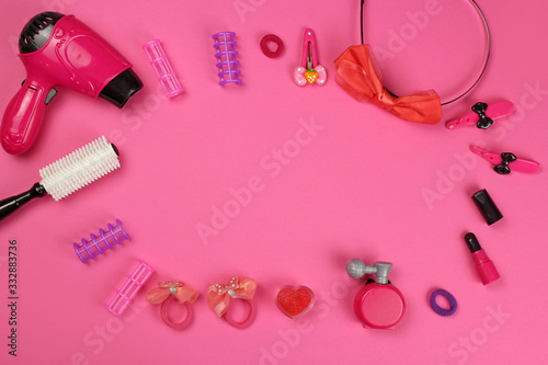 Children 's plastic toys-cosmetics, Barber set, on pink background, layout with copy space