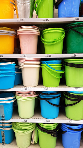 bright color plastic buckets on sale in a store