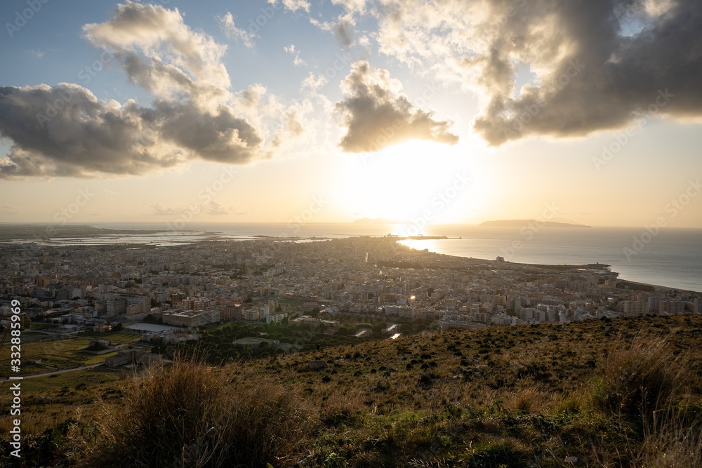 Cityscape of the Trapani city in Sicily at nice sunset with few clouds on sky