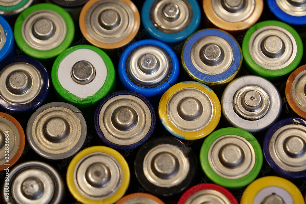 Many multicolored used batteries Many multicolored used batteries