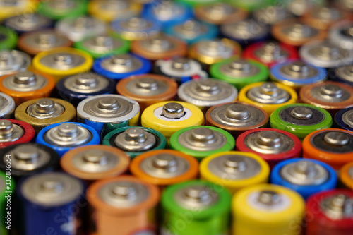 Many multicolored used batteries