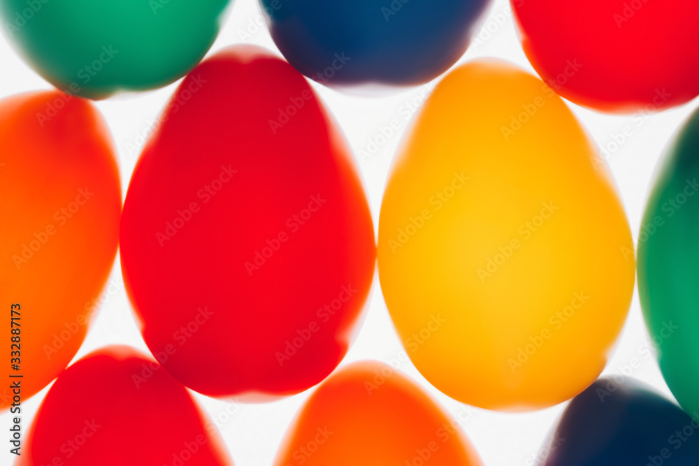 Multicolored Easter eggs in a row Multicolored Easter eggs in a row