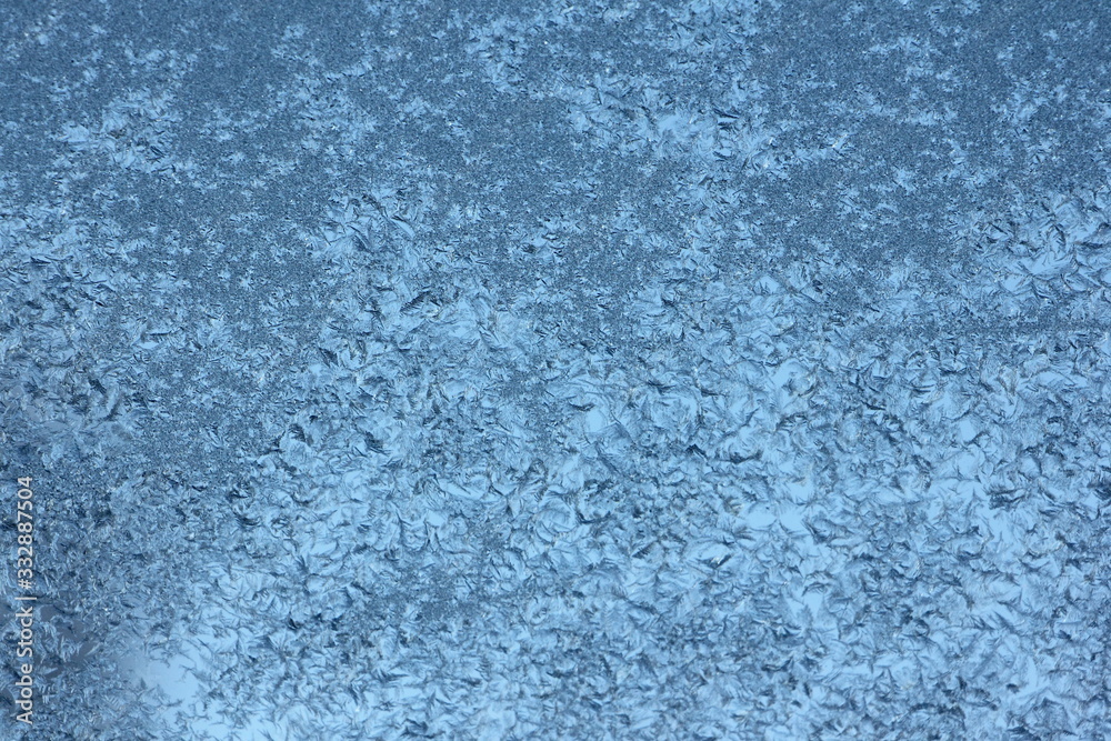 Blue frost crystals background texture on glass Blue frost crystals background texture on glass