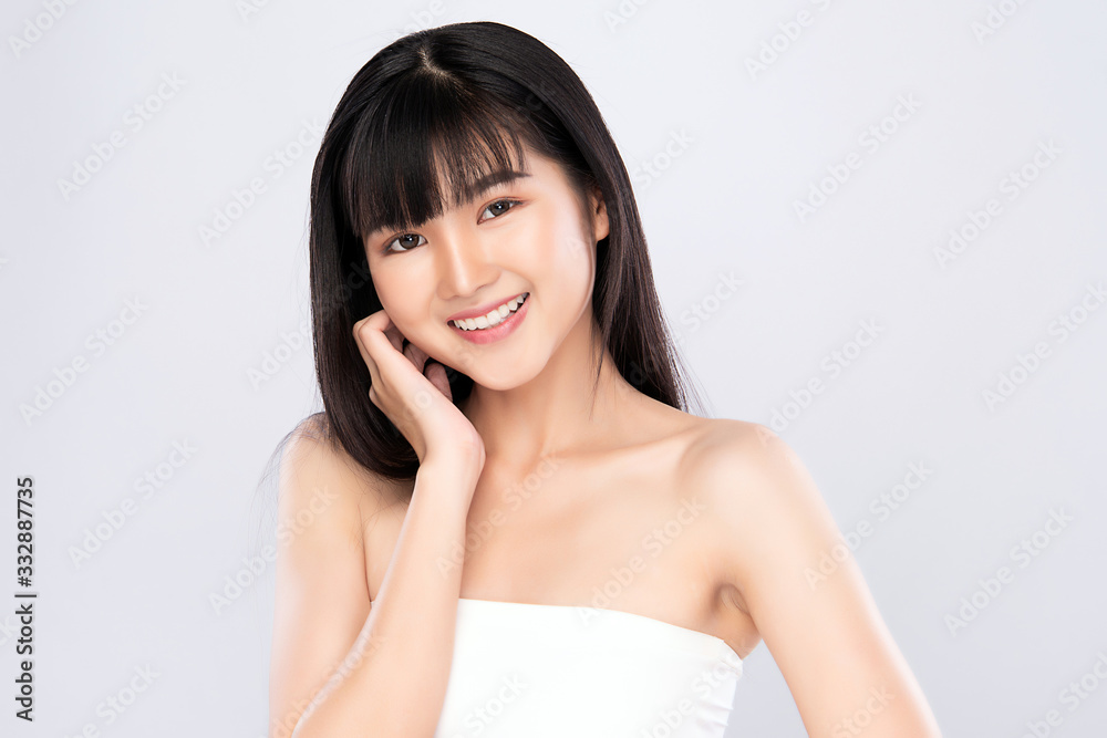 Beautiful Young Asian Woman with Clean Fresh Skin. Face care, Facial treatment, Cosmetology, beauty and healthy skin and cosmetic concept, woman beauty skin isolated on white background Beautiful Young Asian Woman with Clean Fresh Skin. Face care, Facial treatment, Cosmetology, beauty and healthy skin and cosmetic concept, woman beauty skin isolated on white background