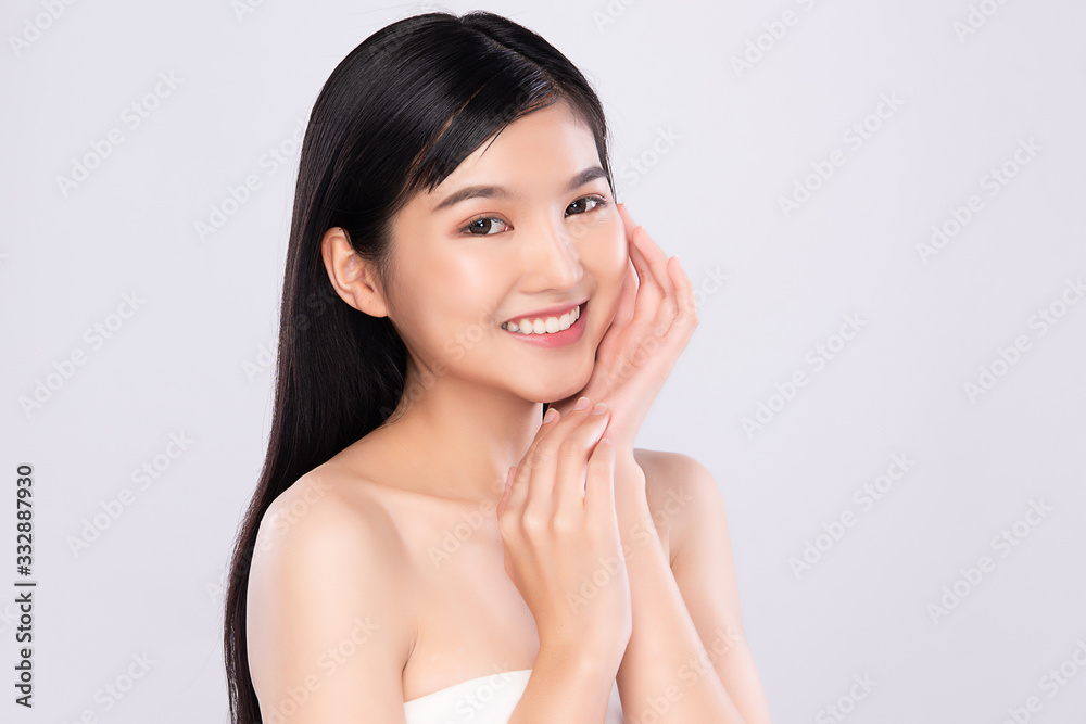 Beautiful Young Asian Woman with Clean Fresh Skin. Face care, Facial treatment, Cosmetology, beauty and healthy skin and cosmetic concept, woman beauty skin isolated on white background Beautiful Young Asian Woman with Clean Fresh Skin. Face care, Facial treatment, Cosmetology, beauty and healthy skin and cosmetic concept, woman beauty skin isolated on white background