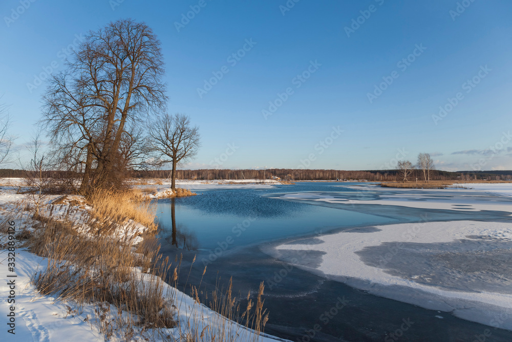 Lake scene with snow during early spring