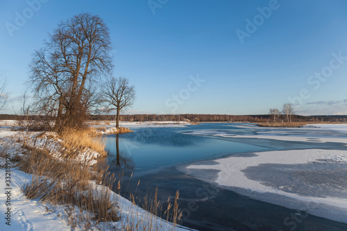 Lake scene with snow during early spring © pixbull