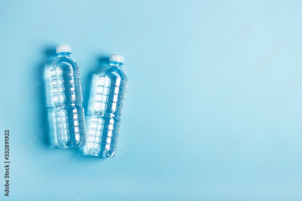 water bottles on a blue background. Health concept water bottles on a blue background. Health concept