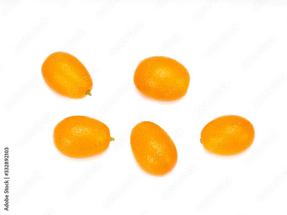 ripe kumquat fruits, isolated on a white background ripe kumquat fruits, isolated on a white background