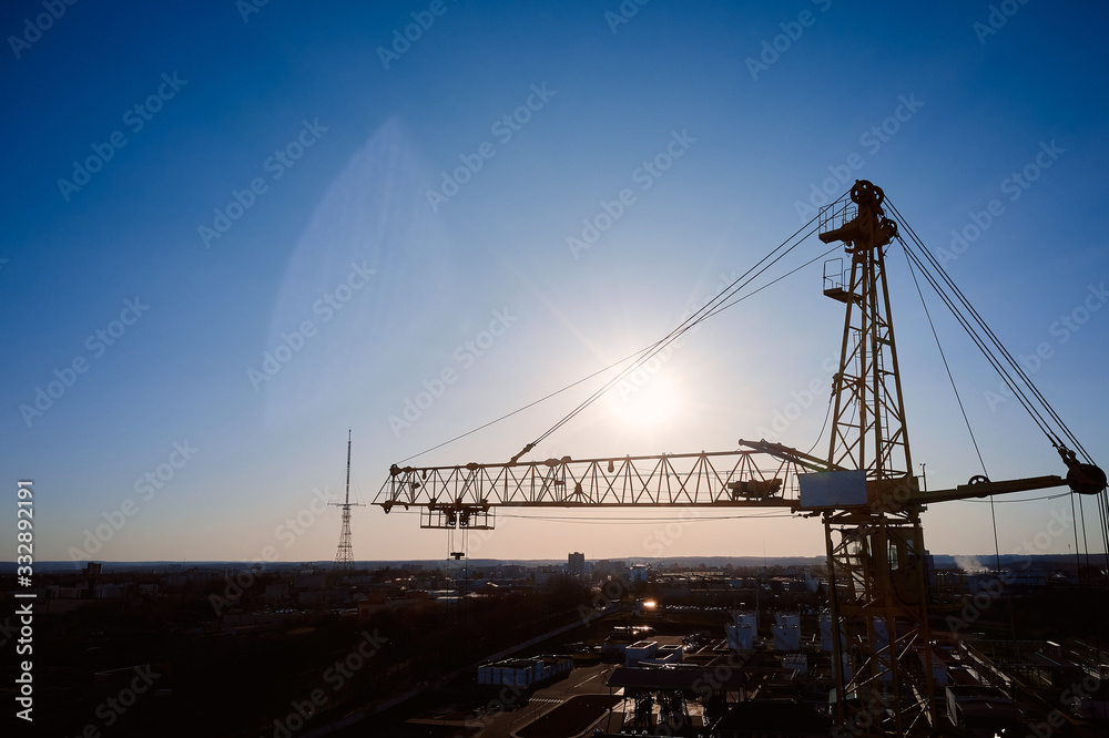 tower crane against the setting sun