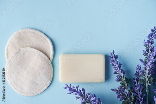 Zero waste cosmetics products, bathroom accessories, natural sisal brush, solid soap and shampoo bars, reusable cotton make up removal pads, make up remover in a glass container.