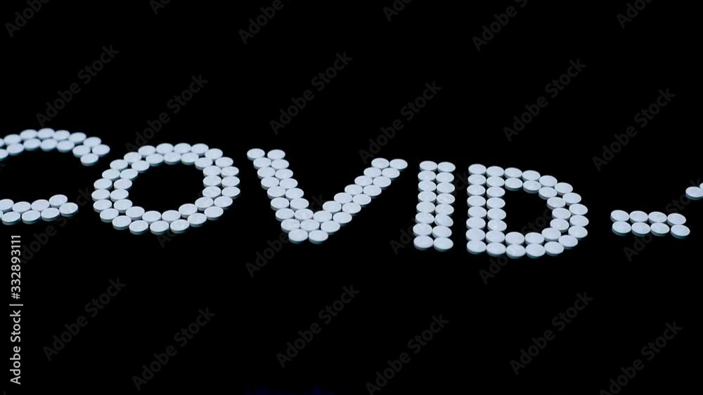 Covid-19 - Wuhan Novel Coronavirus made by many medicine pills isolated on black Covid-19 - Wuhan Novel Coronavirus made by many medicine pills isolated on black