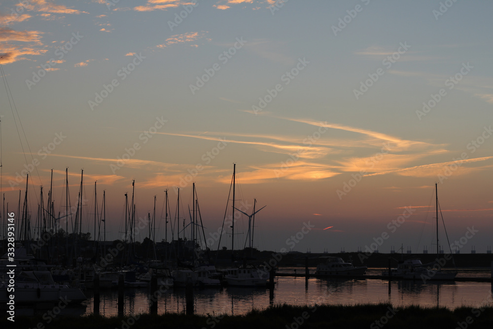 evening falls over the marina with still light spots in the air evening falls over the marina with still light spots in the air