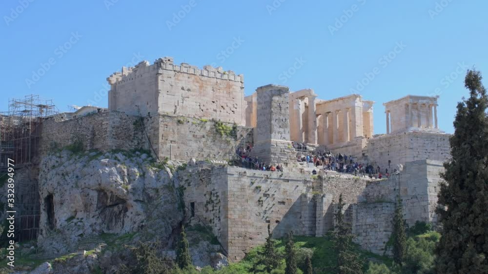 Acropolis view from Areopagus hill with tourists visiting the Parthenon temple