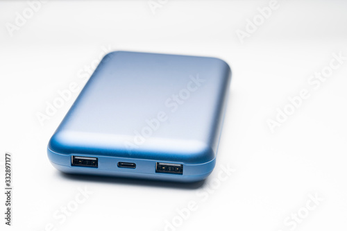 blue power Bank close- up on a white background, selective focus, tinted image