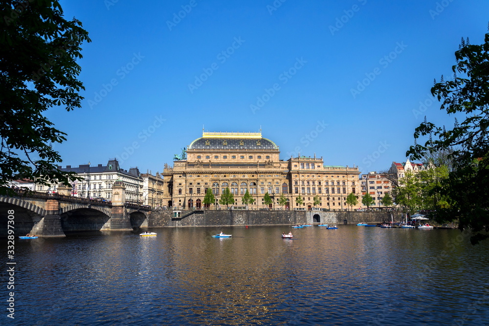 Prague panorama with National Theatre on the bank of Vltava River, Prague, Czech Republic, sunny summer day Prague panorama with National Theatre on the bank of Vltava River, Prague, Czech Republic, sunny summer day