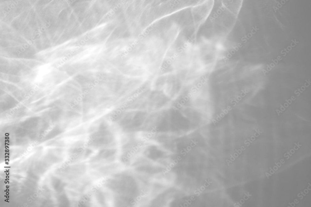 Obraz premium Water texture overlay effect for photo and mockups. Organic drop diagonal shadow and light caustic effect on a white wall. Shadows for natural light effects