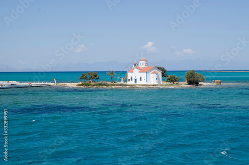 Small white traditional church close to Elafonisos Port in Greece