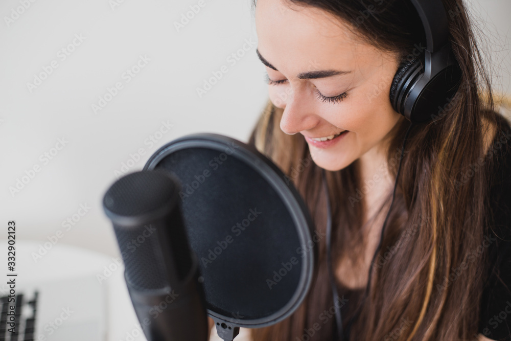 Woman blogger recording radio podcast in studio. Woman blogger recording radio podcast in studio.