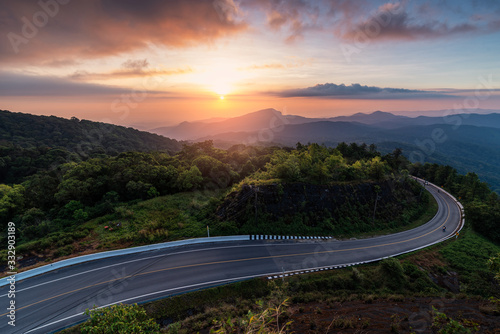 the landscape image of the mountains with road and beautiful twilight sky