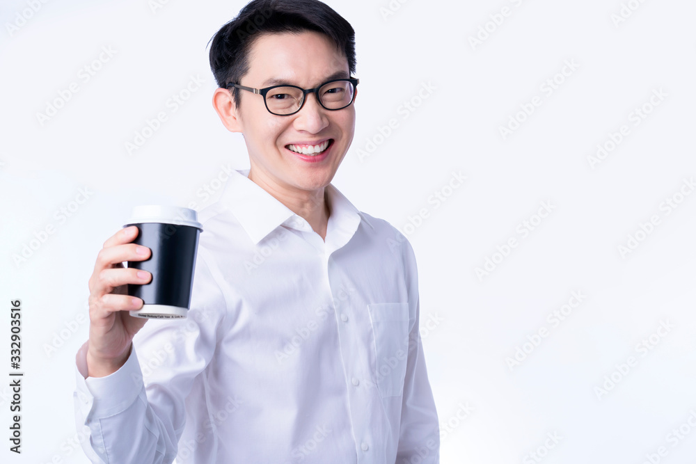 young attractive glasses asian male hand present hot drink coffee cup to you friendly smile and confident,businessman warm welcocme to new comming with hot espresso coffee drink white background