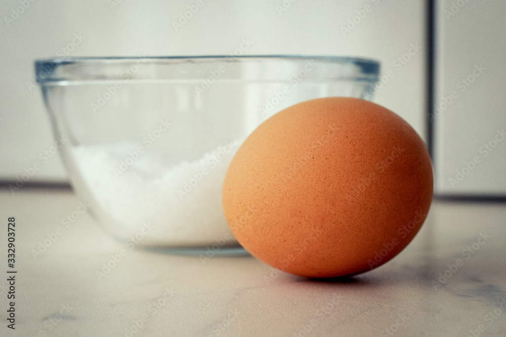 eggs in bowl with whisk on wooden table eggs in bowl with whisk on wooden table