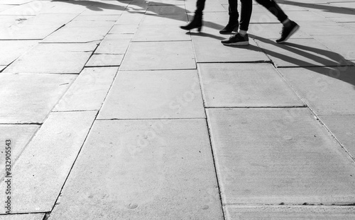 Shadow of People walking in crowded street. Black and White photo of shadow of people. Pedestrian in a street. Blur Shadows of people walking in a street of the city.