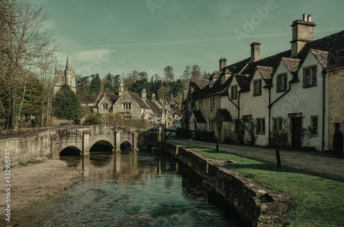 Picturesque Cotswold village of Castle Combe, England.Retro Style  photo