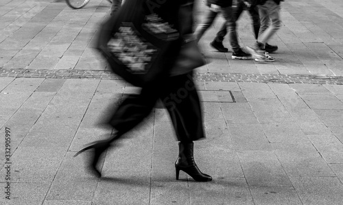 Shadow of People walking in crowded street. Black and White photo of shadow of people. Pedestrian in a street. Blur Shadows of people walking in a street of the city.